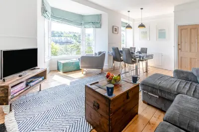 a living room with a couch and a table at 4 Bed in St. Ives oc-brhous in St Ives