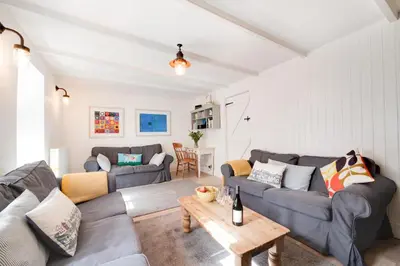 a living room with blue couches and a table at 3 Bed in St Ives oc-car17 in St Ives