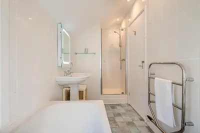a white bathroom with a sink and a shower at 2 Bed in St Ives oc-chyr03 in St Ives