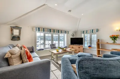 a living room with two blue couches and a tv at 2 Bed in St Ives oc-chyr03 in St Ives