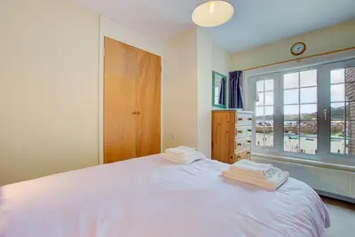 a bedroom with a white bed and a window at 1 Bed in St Ives oc-chyr2 in St Ives