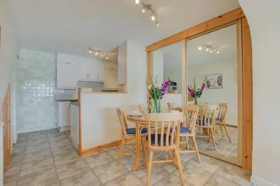 a kitchen and dining room with a table and chairs at 1 Bed in St Ives oc-chyr2 in St Ives