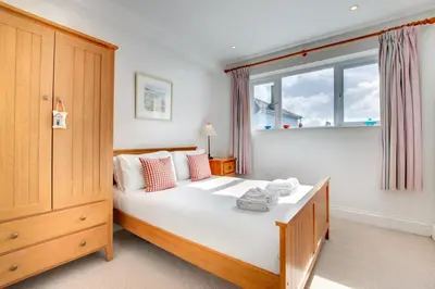 a bedroom with a large bed and a window at 2 Bed in St Ives oc-clv2a in St Ives