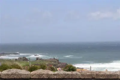 a view of the ocean from a rock ledge at 2 Bed in St Ives oc-clv2a in St Ives