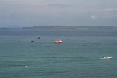 a group of boats in a large body of water at 1 Bed in St Ives oc-crab02 in St Ives