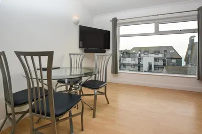 a dining room with a table and chairs and a window at 1 Bed in St Ives oc-clear2 in St Ives