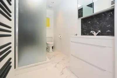 a bathroom with a toilet and a glass shower at 1 Bed in St Ives oc-clear2 in St Ives