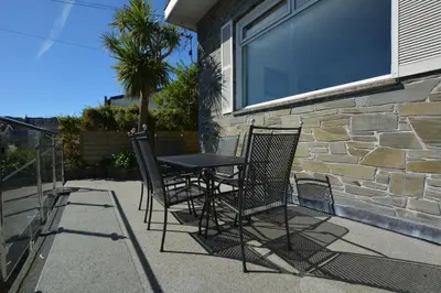a table and chairs sitting outside of a building at 1 Bed in St Ives oc-clear2 in St Ives