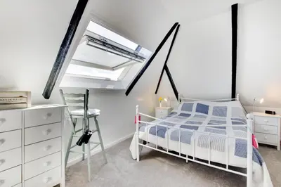 a bedroom with a bed and a chair in it at 1 Bed in St. Ives oc-cp5 in St Ives