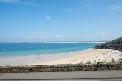 a view of a beach with people in the water at 1 Bed in St Ives oc-cwn014 in St Ives
