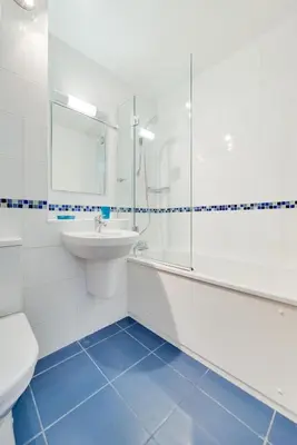 a white bathroom with a sink and a toilet at 1 Bed in St Ives oc-cwn054 in St Ives
