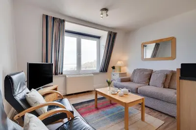 a living room with a couch and a tv at 1 Bed in St Ives oc-cwn054 in St Ives