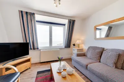 a living room with a couch and a tv at 1 Bed in St Ives oc-cwn054 in St Ives