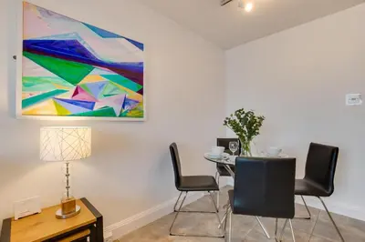 a dining room with a table and a painting on the wall at 1 Bed in St Ives oc-cwn31 in St Ives