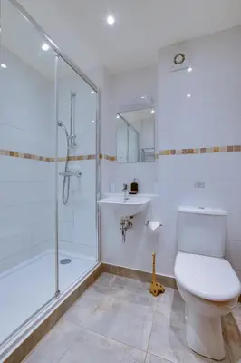 a bathroom with a shower and a toilet and a sink at 1 Bed in St Ives oc-cwn31 in St Ives