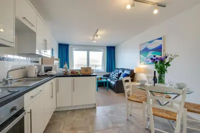 a kitchen and living room with a table and chairs at 1 Bed in St Ives oc-cwn31 in St Ives
