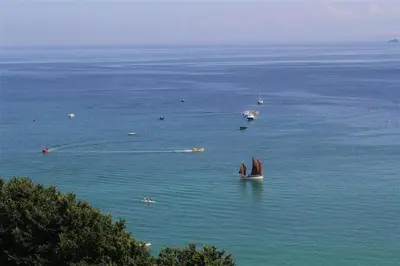a sail boat in the water with other boats at 1 Bed in St Ives oc-cwn31 in St Ives