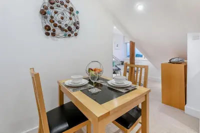 a dining room with a wooden table and chairs at 1 Bed in St Ives oc-decke in St Ives