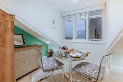 a dining room with a table and chairs and a window at 1 Bed in St Ives oc-decke in St Ives