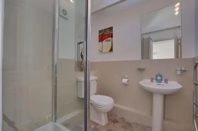 a bathroom with a toilet and a sink and a shower at 1 Bed in St Ives oc-dgy028 in St Ives
