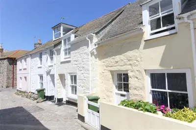 a row of white buildings on a street at 1 Bed in St Ives oc-dgy028 in St Ives