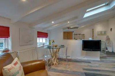 a living room with a couch and a table at 1 Bed in St. Ives oc-drift4 in St Ives