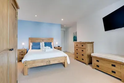 a bedroom with a bed and a flat screen tv at 2 Bed in St Ives oc-f1meor in St Ives