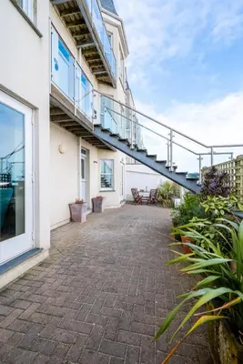 a patio with a staircase on the side of a building at 2 Bed in St Ives oc-f1meor in St Ives