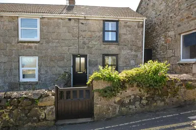 a stone house with a gate and a stone wall at 1 Bed in St. Ives oc-farr in St Ives