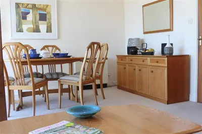 a kitchen with a table and chairs and a dining room at 2 Bed in St Ives oc-fern41 in St Ives