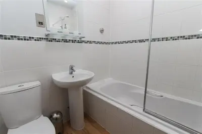 a bathroom with a toilet and a sink and a shower at 2 Bed in St Ives oc-fern41 in St Ives