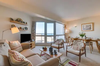 a living room with a couch and a table at 2 Bed in St Ives oc-fern42 in St Ives