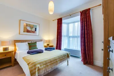 a bedroom with a bed and a large window at 2 Bed in St Ives oc-fern42 in St Ives