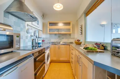 a large kitchen with a sink and a dishwasher at 2 Bed in St Ives oc-fern42 in St Ives