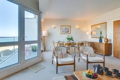 a dining room with a table and chairs and a window at 2 Bed in St Ives oc-fern42 in St Ives