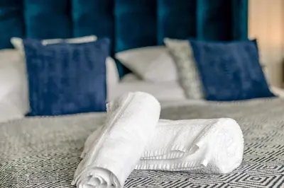 a person with their leg in a cast on a bed at 2 Bed in St Ives oc-godct7 in Carbis Bay