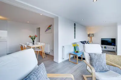 a living room with a couch and a table at 2 Bed in St Ives oc-holm in Carbis Bay