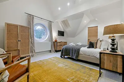 a bedroom with a bed and a large window at 3 Bed in St. Ives oc-l26941 in Carbis Bay