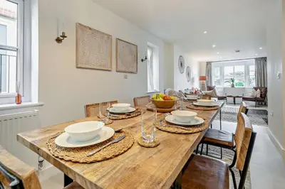 a dining room with a wooden table and chairs at 3 Bed in St. Ives oc-l26941 in Carbis Bay