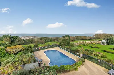 an aerial view of a swimming pool in a garden at 3 Bed in St. Ives oc-l26941 in Carbis Bay