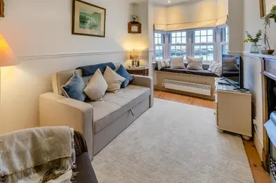 a living room with a couch and a table at 1 Bed in St Ives oc-lhse in St Ives