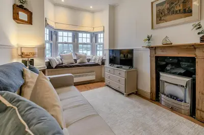 a living room with a couch and a fireplace at 1 Bed in St Ives oc-lhse in St Ives
