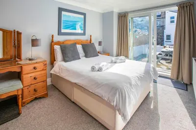 a bedroom with a bed with two stuffed animals on it at 2 Bed in St Ives oc-lookcv in St Ives