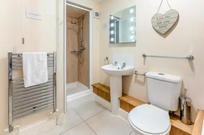 a bathroom with a toilet and a sink and a shower at 2 Bed in St Ives oc-lookcv in St Ives