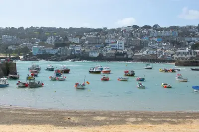 a group of boats in the water in a harbor at 2 Bed in St Ives oc-lookcv in St Ives