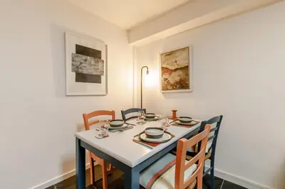 a dining room with a table and chairs at 1 Bed in St Ives oc-nic01 in St Ives