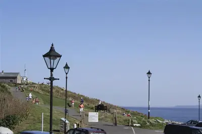 a street light on the side of a road near the ocean at 1 Bed in St Ives oc-nicc41 in St Ives
