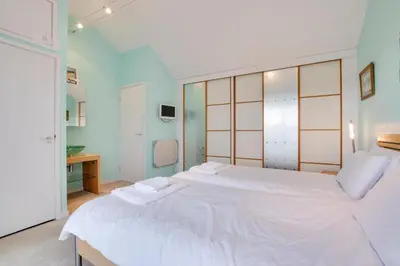 a bedroom with a large white bed with two towels on it at 1 Bed in St Ives oc-nicc41 in St Ives