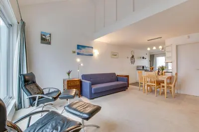 a living room with a blue couch and a table at 1 Bed in St Ives oc-nicc41 in St Ives