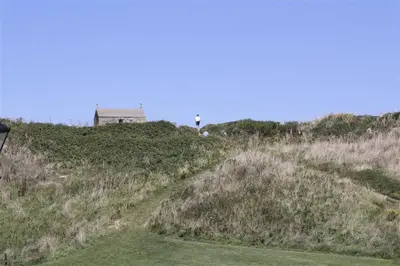 a house on the top of a grassy hill at 1 Bed in St Ives oc-nicc41 in St Ives